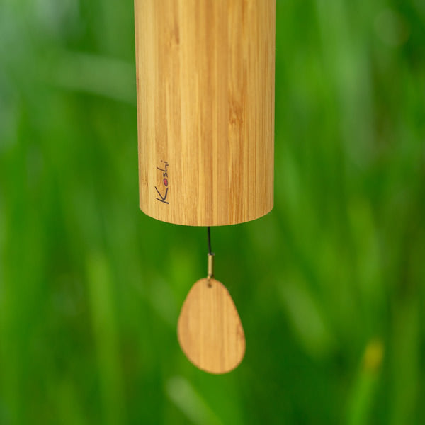 Close-up of Koshi Ignis wind chime with red dot