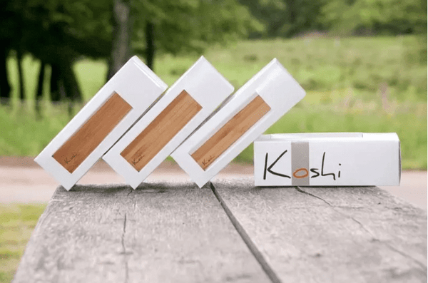 Koshi Wind Chimes full set displayed on a table with Koshi emblem, Aria, Terra, Ignis, Aqua